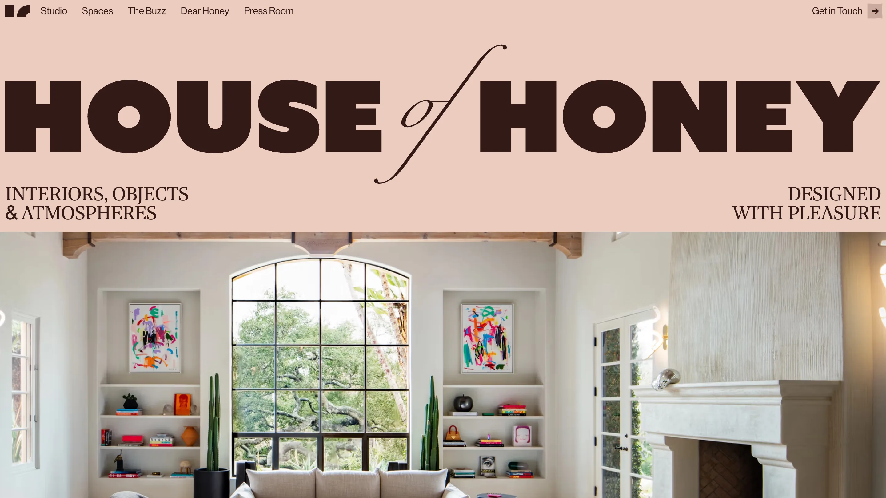House of Honey homepage: a blush band with HOUSE of HONEY set very large in chocolate brown, the word of in italic script, above a photograph of a living room with a tall arched window