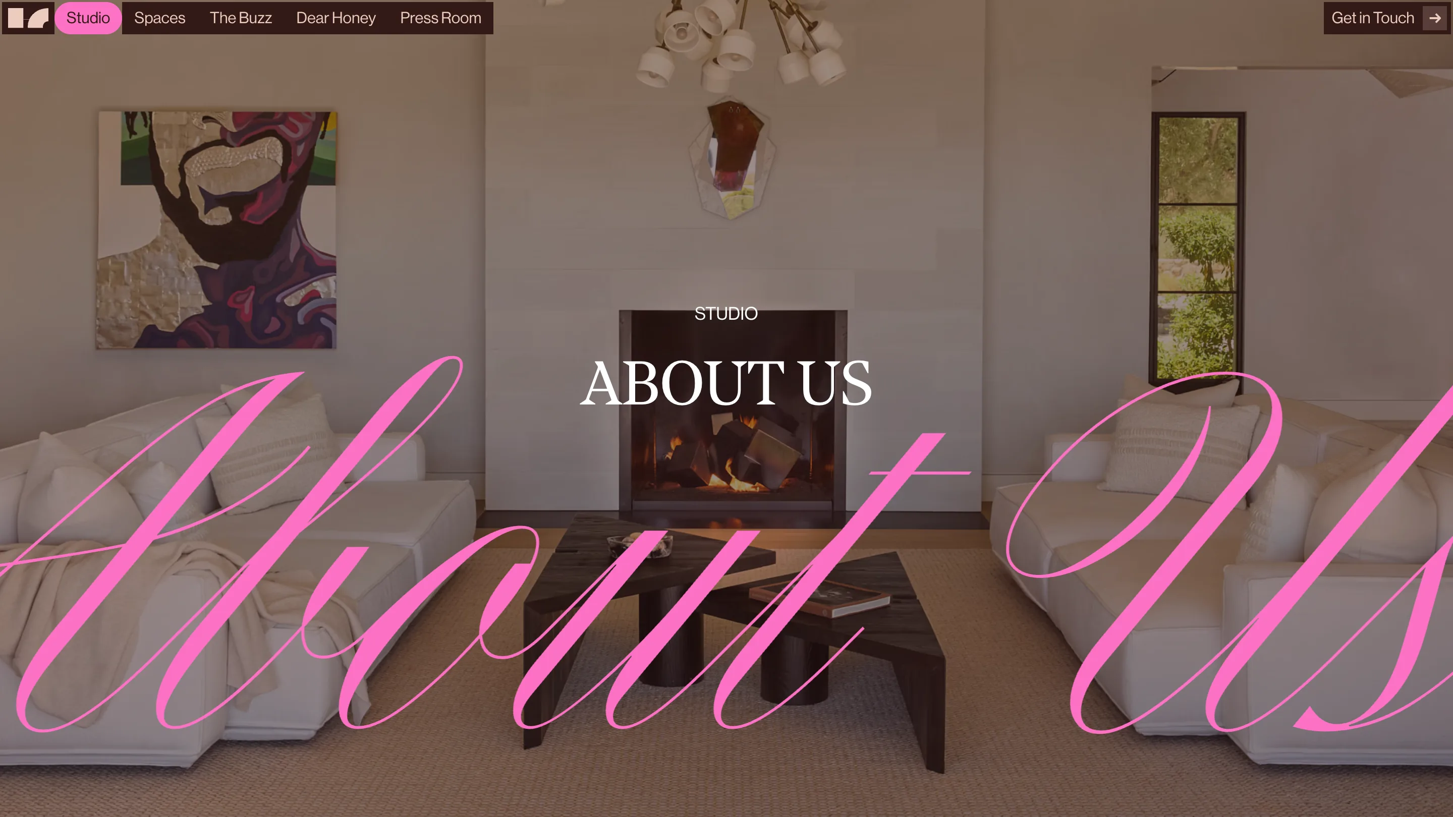 House of Honey studio page: a living room with a lit fireplace and cream sofas, with a giant semi-transparent hot-pink script reading About Us running across the full width and a small white serif ABOUT US centred on top