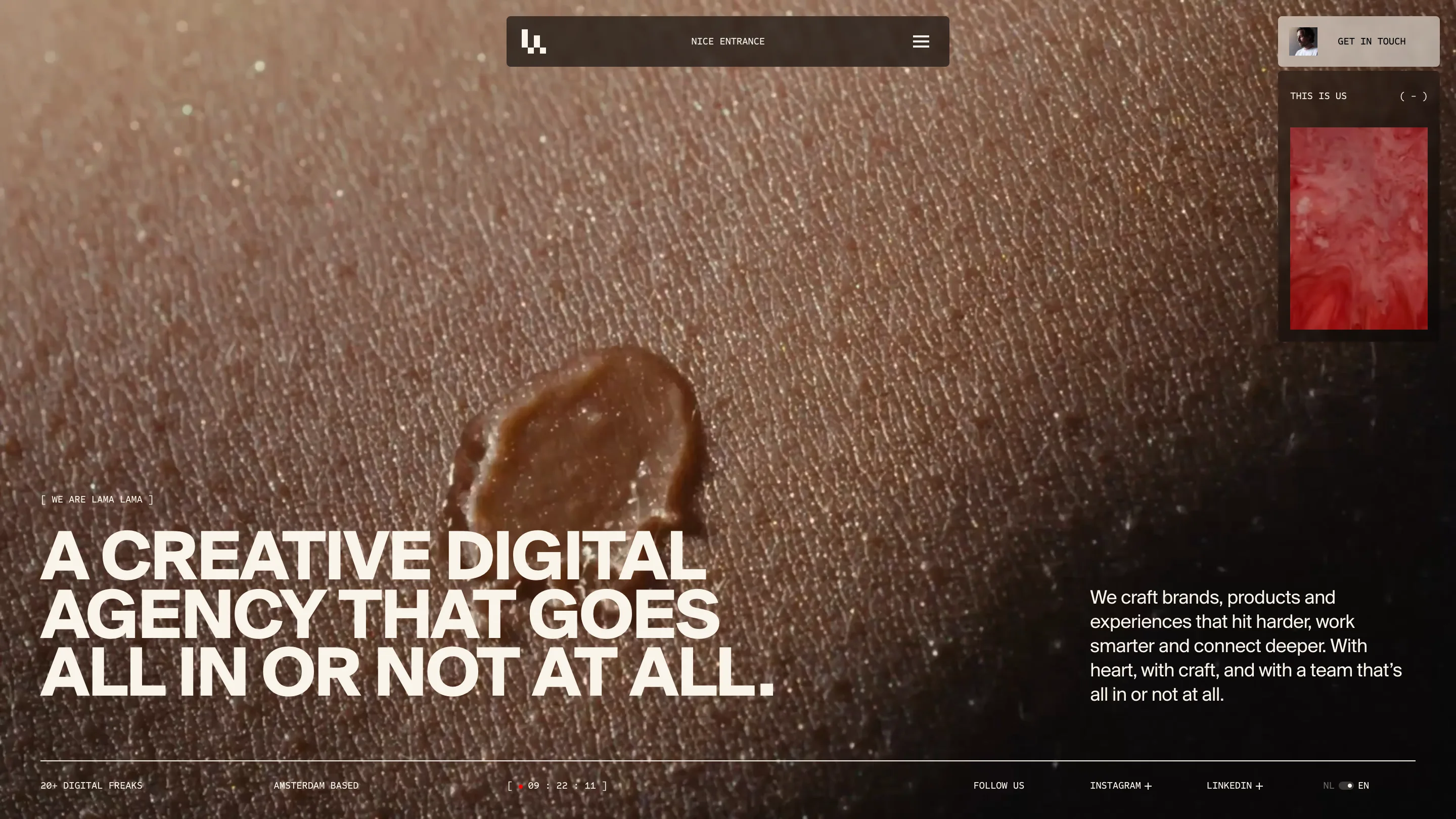 Lama Lama homepage: macro footage of a caramel drop on skin in warm brown, with the cream headline A CREATIVE DIGITAL AGENCY THAT GOES ALL IN OR NOT AT ALL and a floating dark nav pill labelled NICE ENTRANCE